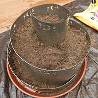 herb spiral with fresh soil prior to planting
